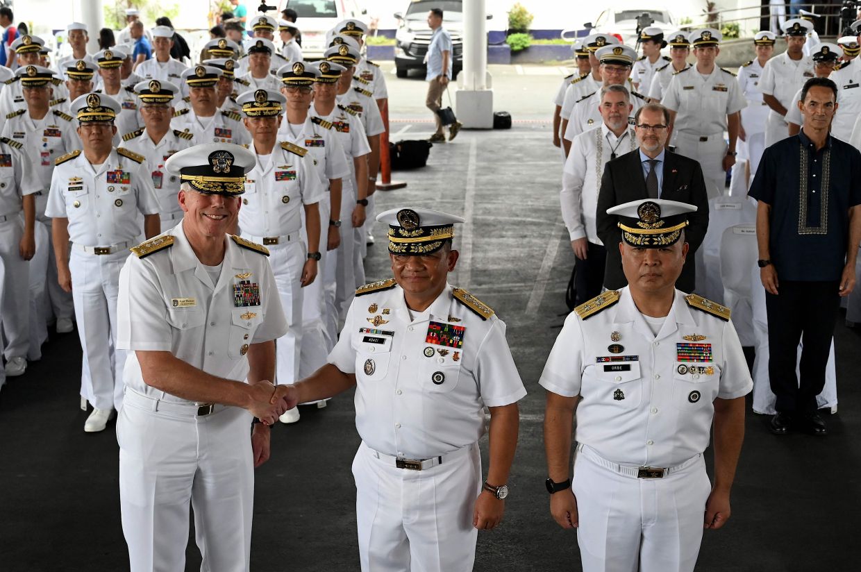 Vice Admiral Karl Thomas, Commander of the US 7th Fleet and Vice Admiral Toribio Adaci Jr, Flag Officer in Command of Philippine Navy Exercise Scheduling SAMASAMA 2023, shake hands during the opening ceremony of Exercise SAMASAMA 2023, the annual bilateral navy-to-navy exercise between the Philippines and US at Philippine Navy Headquarters in Manila