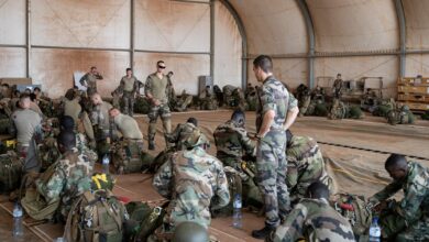 French soldiers of the 2e Regiment Etranger de Parachutistes prepare for a mission on the French BAP air base, in Niamey