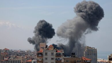 Smoke billows from a residential building following an Israeli airstrike in Gaza City