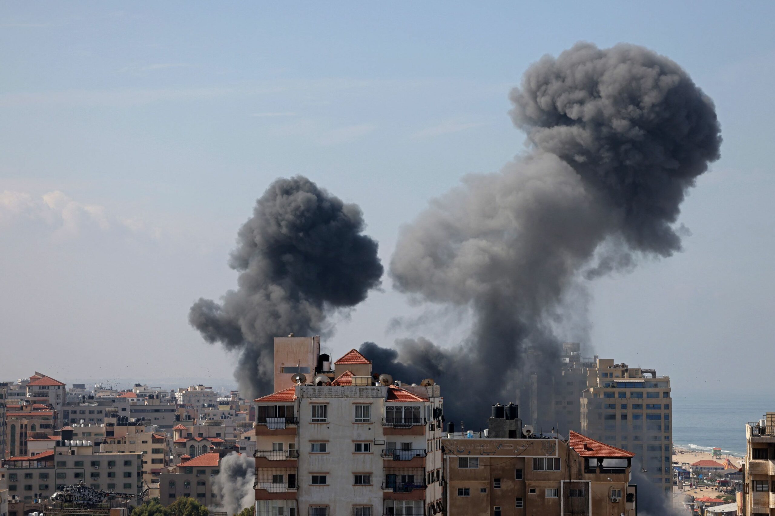 Smoke billows from a residential building following an Israeli airstrike in Gaza City