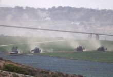 A picture taken from southern Israel along the border with the Gaza Strip shows Israeli army tanks and buldozers crossing the border into Gaza, on October 29, 2023