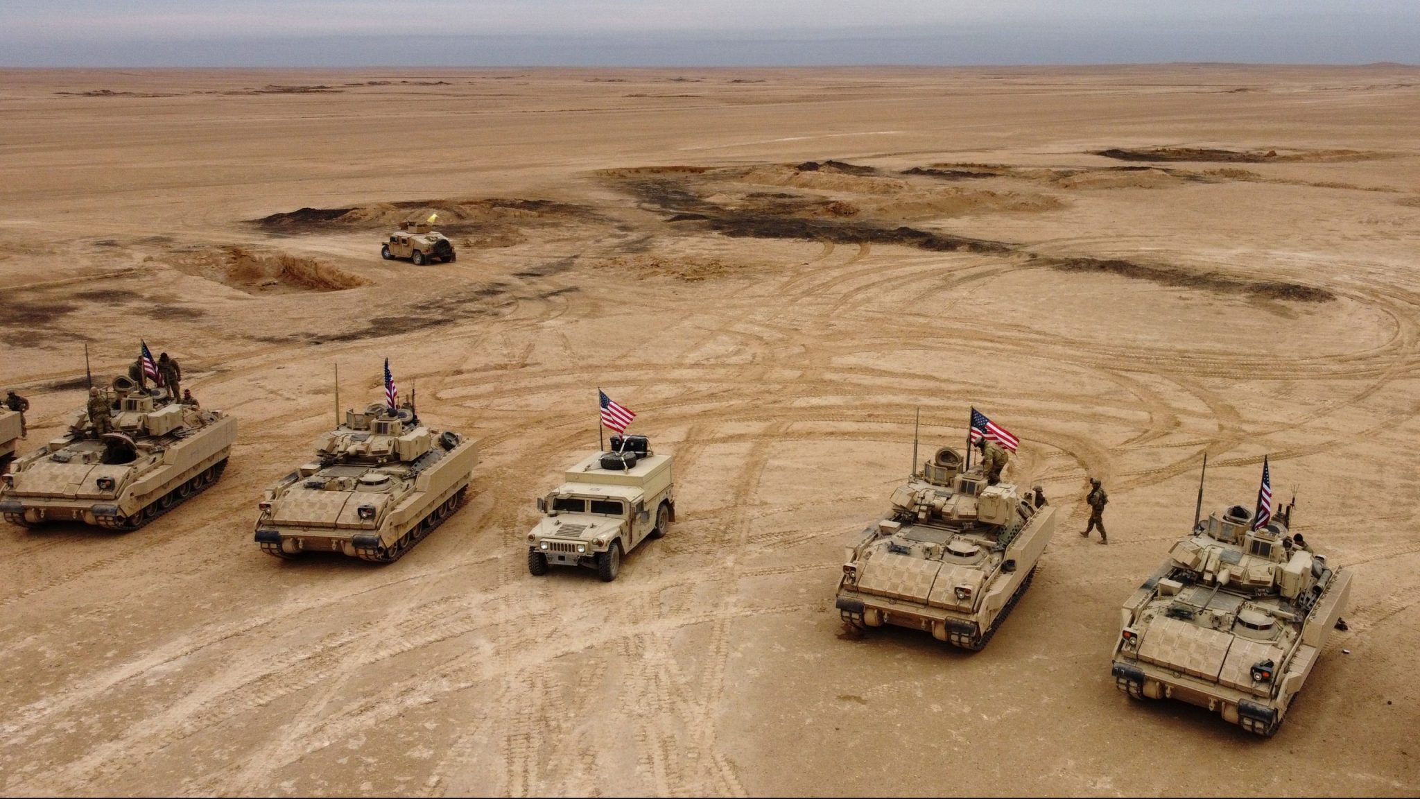 Aerial view of US Bradley Fighting Vehicles (BFV) during a joint military exercise between the Syrian Democratic Forces (SDF) and the US-led international coalition against the Islamic State (IS) group, in the countryside of Deir-ez-Zor