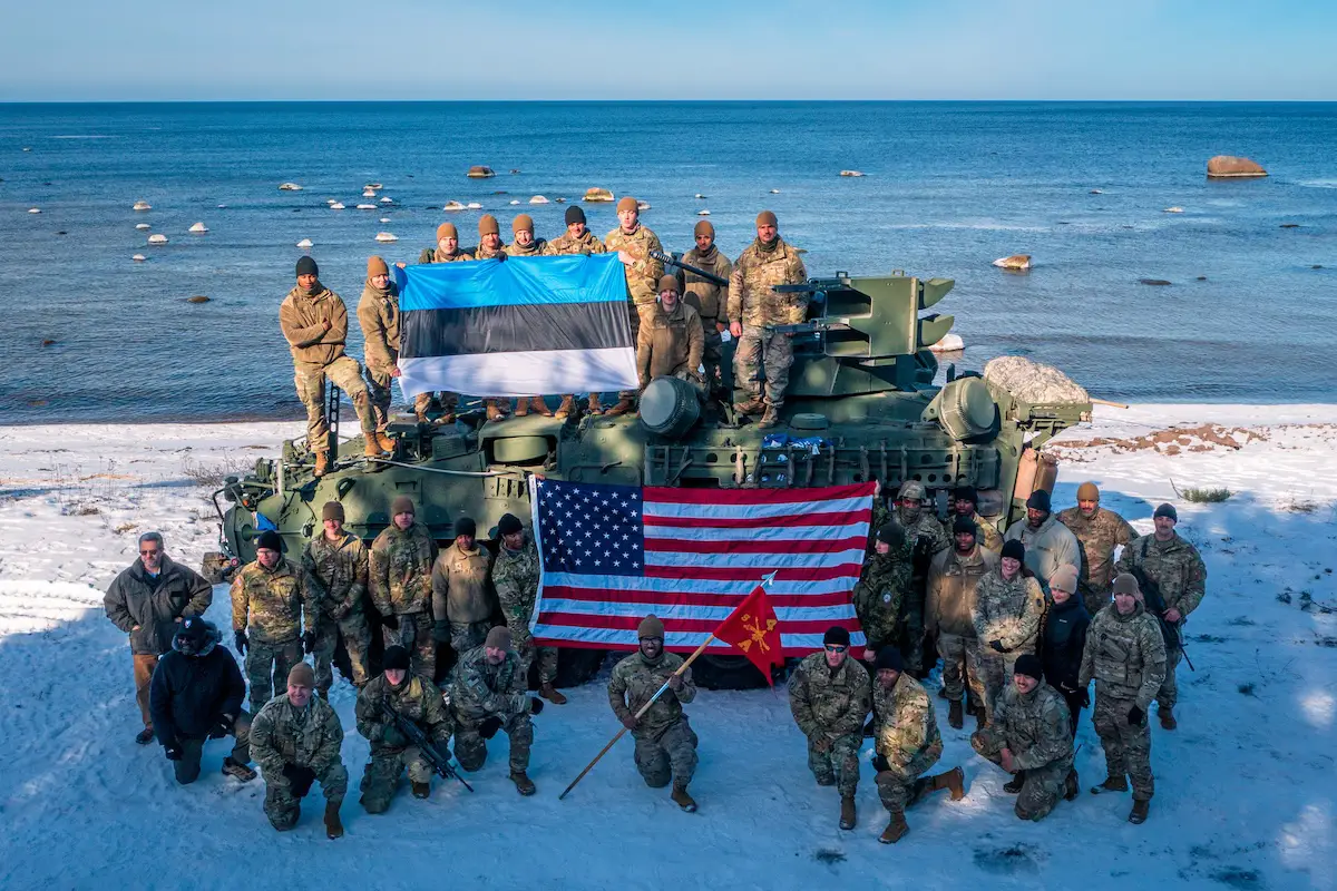 Estonian and US Army soldiers pose with the US Army’s Maneuver Short Range Air Defense Stryker