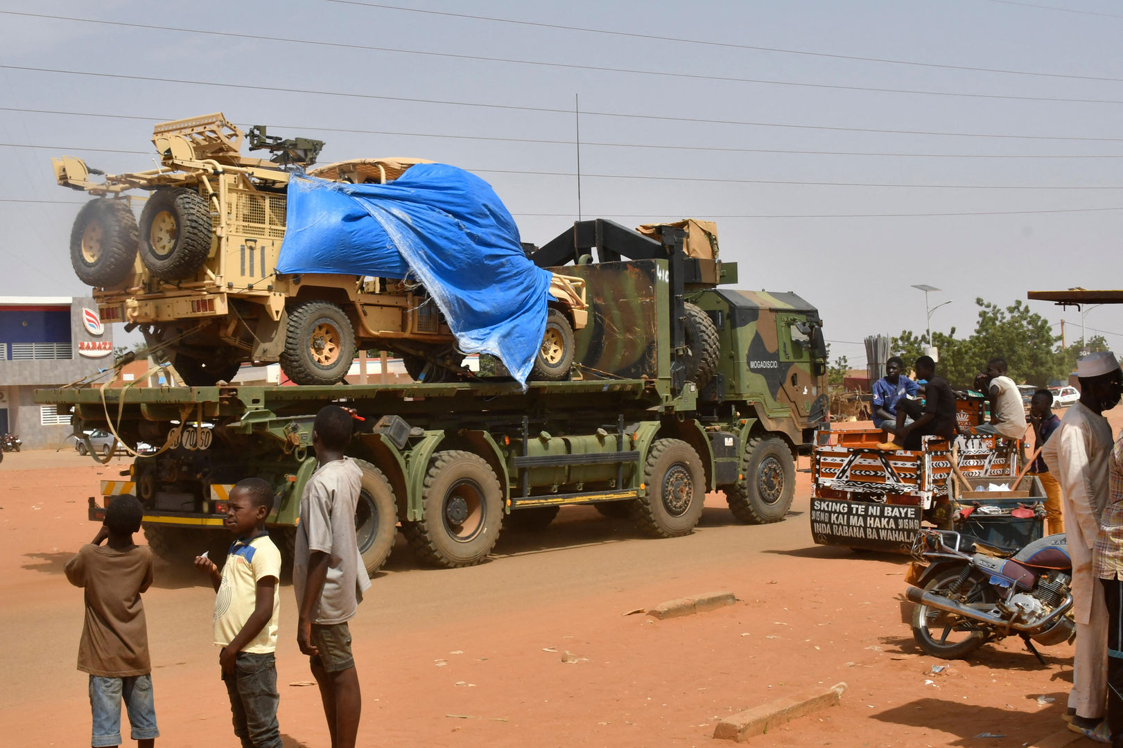A military truck of the Nigerien security forces, part of an escort to a French Army military convoy crosses the Lazaret district in Niamey