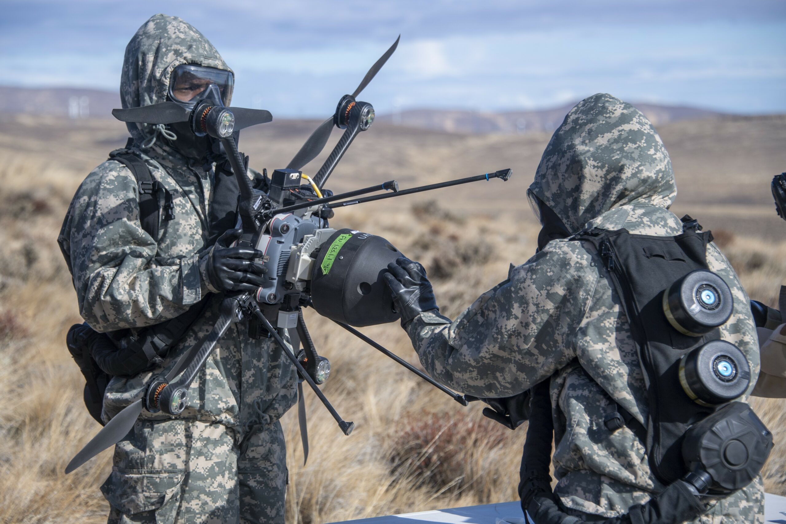Test participants of the 45th Chemical, Biological, Radiological, and Nuclear (CBRN) Hazard Response Company, process a sample to run on the hand-held assay (HHA) to confirm or deny the presence of biological warfare agents prior to conducting a decontamination event. (U.S. Army photo by Tad Browning)