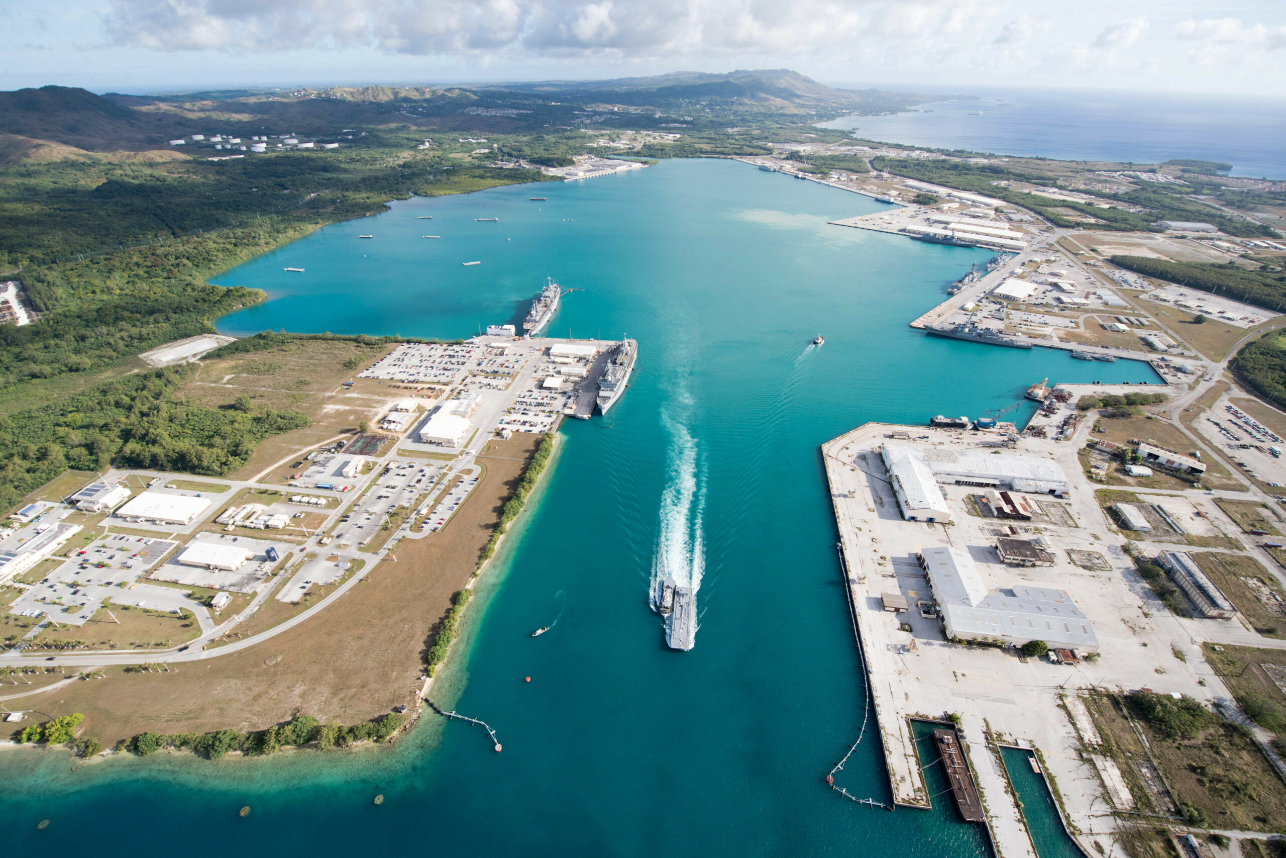 An aerial view of U.S. Naval Base Guam shows several Navy vessels moored in Apra Harbor, March 15. Some of the vessels are in Guam in support of Multi-Sail 2018 and Pacific Partnership 2018. This year also marks the 75th anniversary of the establishment of U.S. 7th Fleet. (U.S. Navy Combat Camera photo by Mass Communication Specialist 1st Class Stacy D. Laseter)
