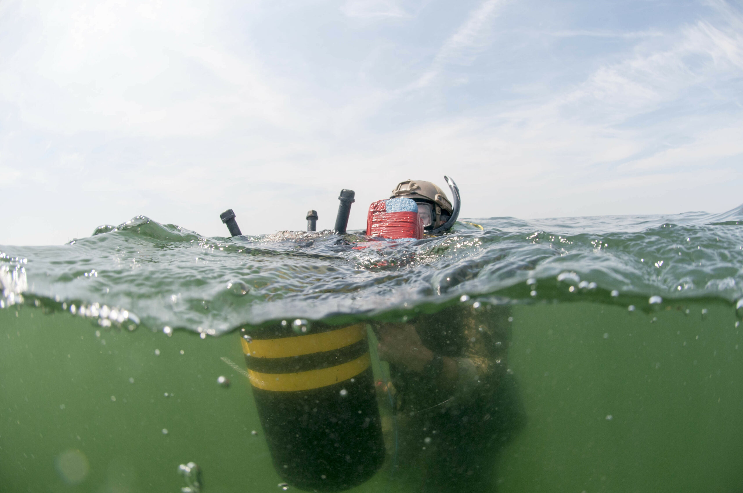 190820-N-AP176-0392 VIRGINIA BEACH, Va. (Aug. 20, 2019) An explosive ordnance disposal (EOD) technician assigned to EOD Mobile Unit (EODMU) 2 prepares inert training demolition during mine countermeasure training. EODMU 2 provides credible, combat-ready EOD forces capable of deploying anywhere, any time in support of national interests. (U.S. Navy photo by Chief Mass Communication Specialist Jeff Atherton/Released)