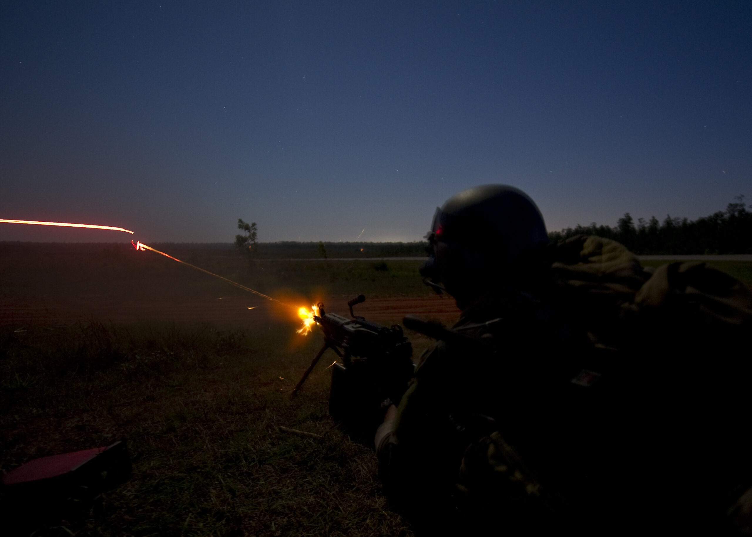 A Marine from 2nd Marine Special Operations Battalion fires at a training target during a live-fire exercise on Eglin Range, Fla., May 21, 2013. Marines fired several different machine guns and also used infrared laser to designate training targets for AC-130 Spooky gunship fire. (U.S. Air Force Photo/ Staff Sgt. John Bainter)