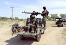 A photo taken on Nov. 12 shows Cameroonian soldiers patrolling in Amchide, less than a mile from the border with Nigeria