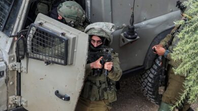 Israeli army soldier looks on during a military operation