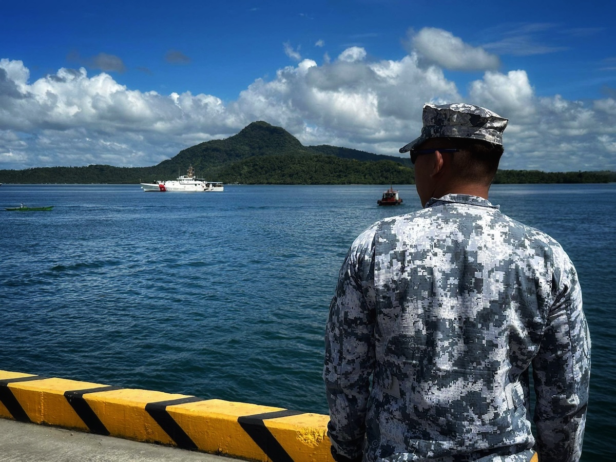 Philippine Coast Guard prepares to receive the crew of the USCGC Frederick Hatch (WPC 1143) at the pier in Tacloban, Philippines