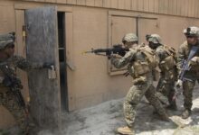 US Marines practice entering buildings during a military operations on urban terrain exercise at Marine Corps Base Camp Lejeune, 2015