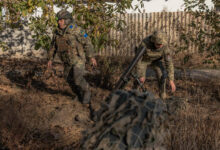 Ukrainian forces fire a mortar over the Dnipro river toward Russian positions