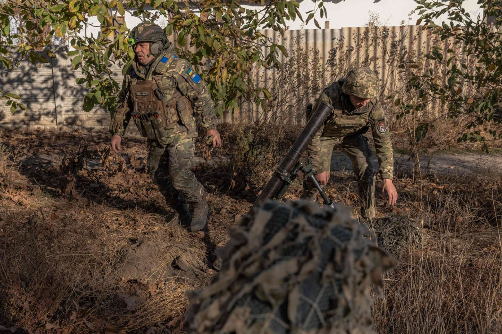 Ukrainian forces fire a mortar over the Dnipro river toward Russian positions