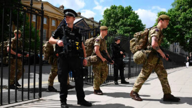 British soldiers arrive at a Ministry of Defence building near to New Scotland Yard police headquarters, London