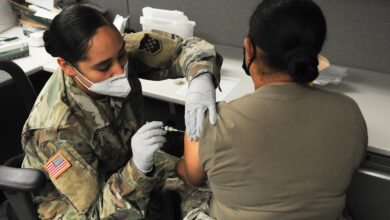 Master Sgt. Daniela Davis, right, receives a flu shot from Sgt. Veronica Ygarza as part of the 99th Readiness Division’s in-house flu clinic for the 2020-2021 flu season. The flu-shot program is being administered by the division’s Surgeon’s Office and Soldier Readiness Improvement Program team. Three-hundred vaccinations are being provided to 99th RD Soldiers and civilian employees during normal duty hours and Battle Assembly weekends. (U.S. Army photo by Mr. Sal Ottaviano)