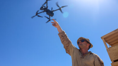 U.S. Marine Corps Cpl. Justin Wambold, a forward observer assigned to Charlie Company, Battalion Landing Team 1/5, 15th Marine Expeditionary Unit, launches a Skydio X2D, a small unmanned aerial system, to capture overhead imagery during squad attacks as part of Realistic Urban Training exercise at Yuma Proving Grounds, Arizona, Aug. 15, 2023. RUT is a land-based predeployment exercise which enhances the integration and collective capability of the Marine Air-Ground Task Force while providing the 15th MEU an opportunity to train and execute operations in an urban environment. (U.S. Marine Corps photo by Cpl. Aidan Hekker)