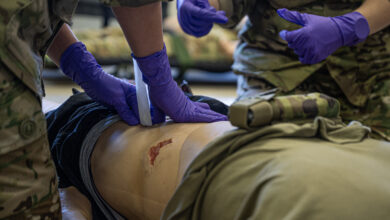 Danish air force 1st Lt. Freya Lyngso packs a wound on a medical mannequin during a demonstration at Ramstein Air Base, Germany, Nov. 29, 2023. Lyngso and other members from Denmark joined personnel from Bulgaria, Serbia and the U.S. for a knowledge exchange where they participated in demonstrations and briefings where they traded information they may find useful at their home stations. (U.S. Air Force photo by Senior Airman Thomas Karol)