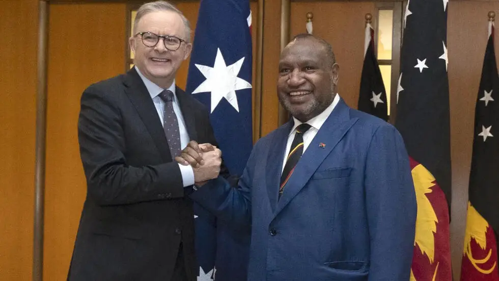 Papua New Guinea Prime Minister James Marape (R) shakes hands with Australian Prime Minister Anthony Albanese in Canberra