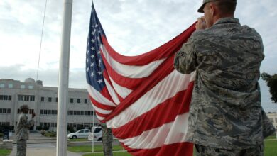 American soldier raising US flag