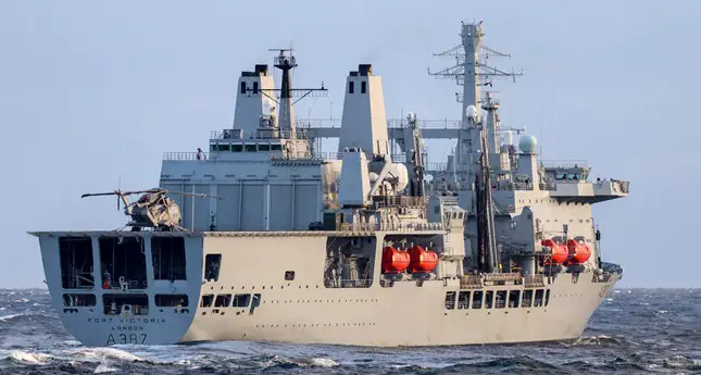 RFA Fort Victoria is seen sailing in calm waters. The ship is painted gray.