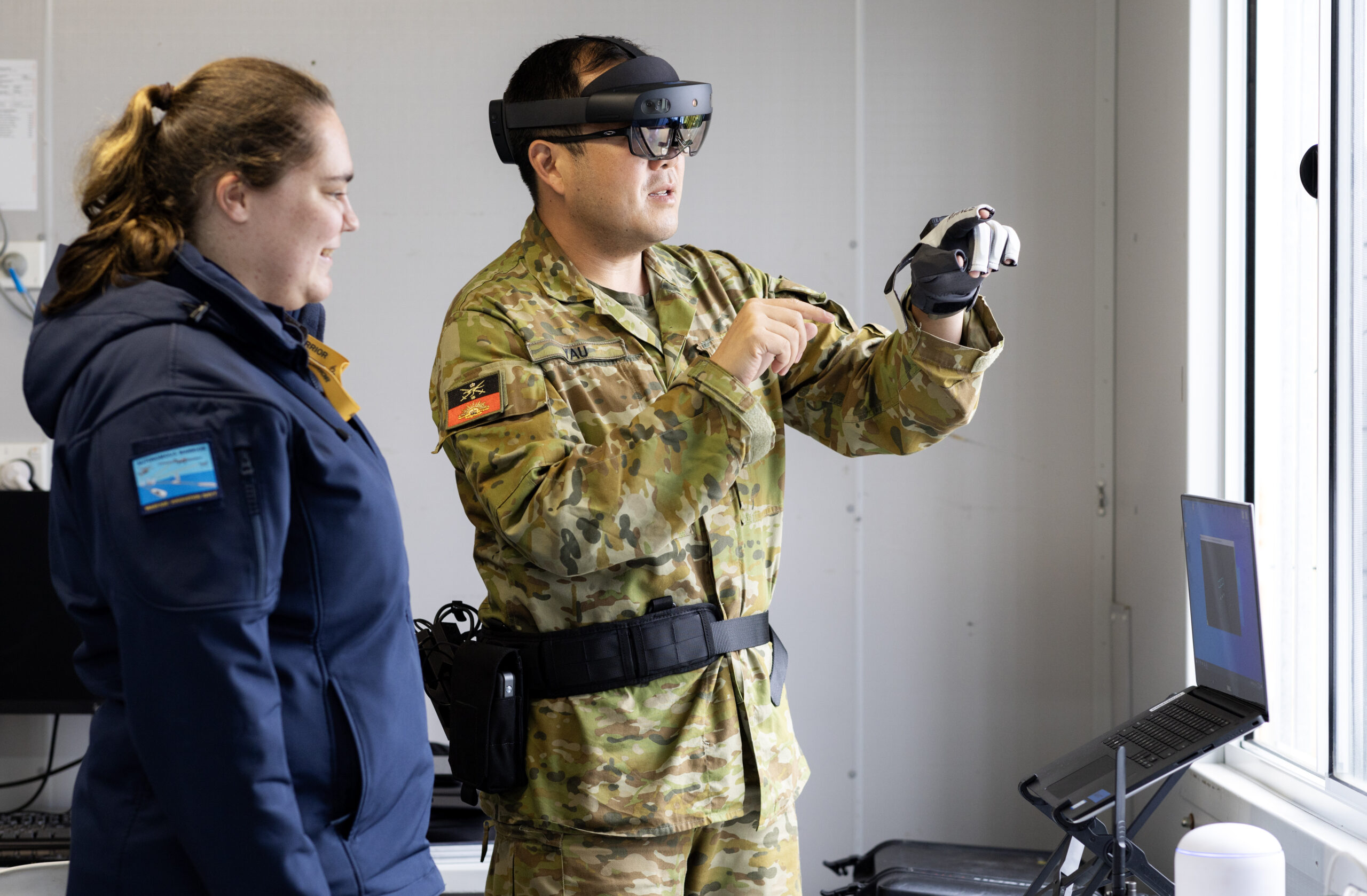 Caitlyn Sims and Major Ivan Yau demonstrate Multimodal Edge 4 (MEC4) during the Technical Cooperation Program AI Strategic Challenge 2023 at HMAS Creswell, Jervis Bay Territory. *** Local Caption *** The Technical Cooperation Program (TTCP) AI Strategic Challenge (AISC) 2023 will be held at HMAS Creswell, 09-27 October 2023.Bringing together Five Eyes (FVEY) nations personnel, AISC 2023 will have a program of live experiments and demonstrations across a variety of systems, situated in a scenario representative of a full military operation. AISC 2023 is seeking to accelerate the transition of Artificial Intelligence (AI) solutions into the hands of coalition armed forces.