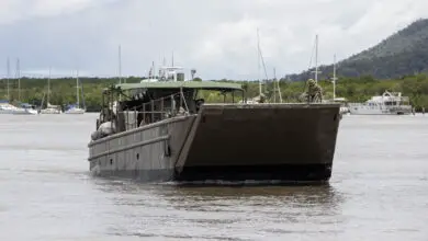 An Australian Army Landing Craft Mechanised Mk8 (LCM8) from 10 Forces Support Battalion arrives in Cairns, Queensland as part of Australian Defence Force support recovery efforts in the region after Ex Tropical Cyclone Jasper. *** Local Caption *** The Australian Defence Force is providing support to the Queensland Reconstruction Agency to access and resupply isolated and vulnerable communities in the vicinity of Douglas, Cook and Wujal Wujal ahead of the wet season. Defence is providing Australian Army CH-47F Chinook helicopters and a landing craft to transport bulk resupply and delivery of engineering equipment into isolated communities currently recovering from Ex-Tropical Cyclone Jasper. Additionally, Defence will provide personnel and equipment to help clear access and larger scale debris to isolated communities, as well as specialist aviation and maritime planning and light engineering support.