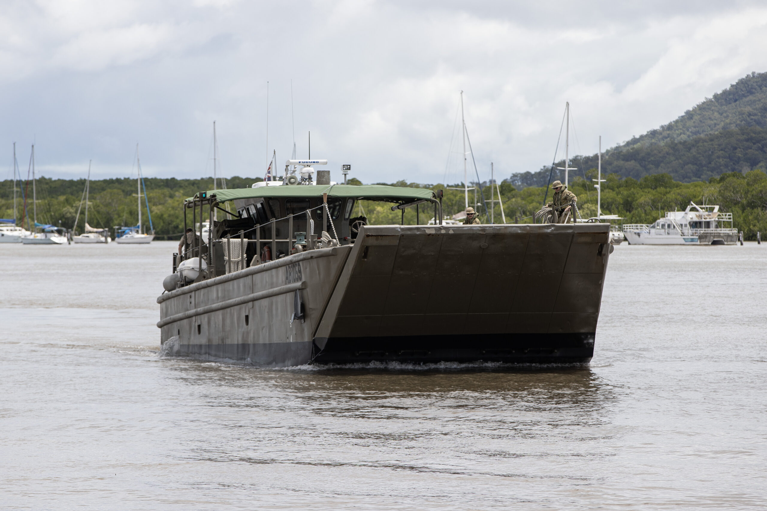 An Australian Army Landing Craft Mechanised Mk8 (LCM8) from 10 Forces Support Battalion arrives in Cairns, Queensland as part of Australian Defence Force support recovery efforts in the region after Ex Tropical Cyclone Jasper. *** Local Caption *** The Australian Defence Force is providing support to the Queensland Reconstruction Agency to access and resupply isolated and vulnerable communities in the vicinity of Douglas, Cook and Wujal Wujal ahead of the wet season. Defence is providing Australian Army CH-47F Chinook helicopters and a landing craft to transport bulk resupply and delivery of engineering equipment into isolated communities currently recovering from Ex-Tropical Cyclone Jasper. Additionally, Defence will provide personnel and equipment to help clear access and larger scale debris to isolated communities, as well as specialist aviation and maritime planning and light engineering support.