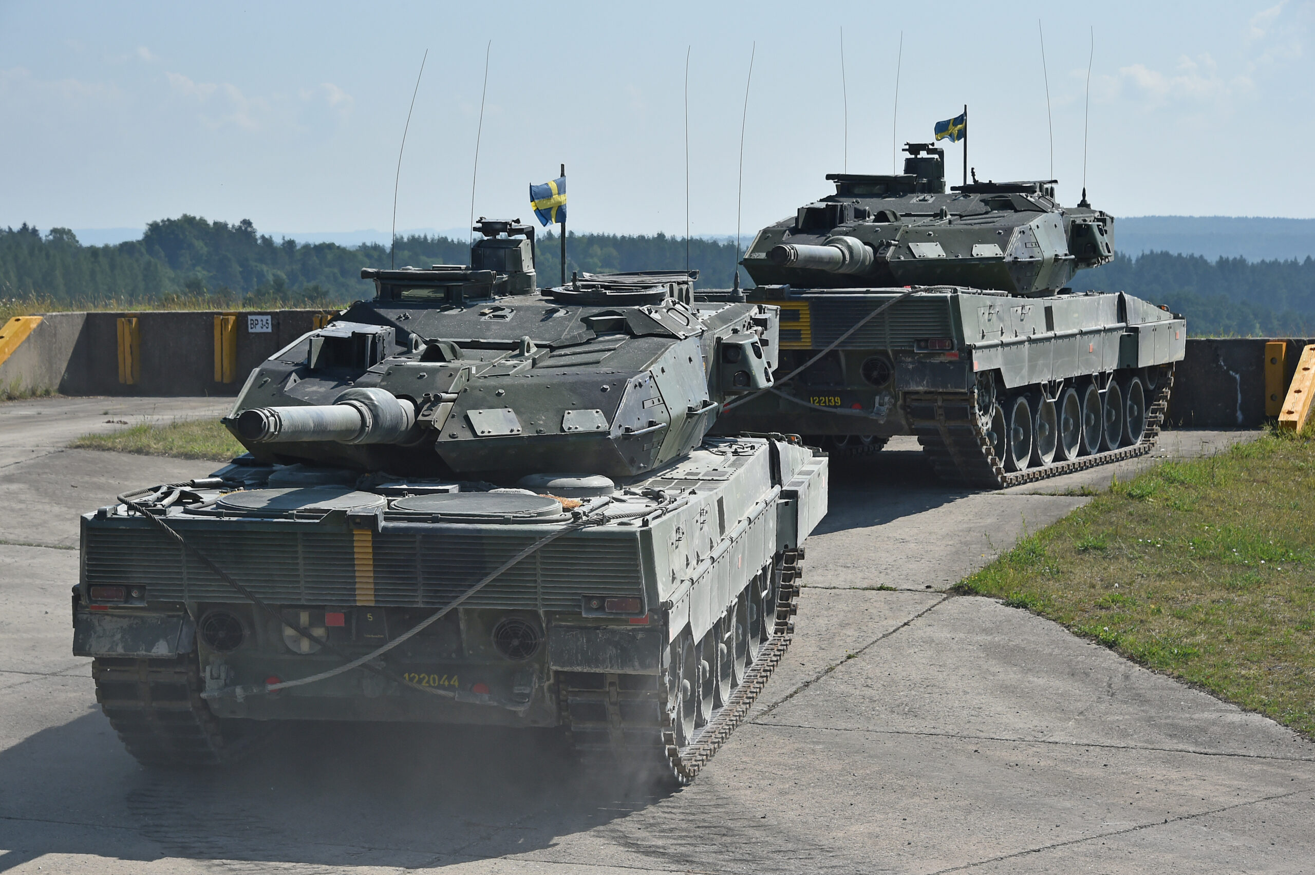 Swedish soldiers with the Wartofta Tank Company, Skaraborg Regiment in their Stridsvagn 122 main battle tank tow away another tank as part of the Chemical, Biological, Radiological, Nuclear, and Explosive Agents lane during the Strong Europe Tank Challenge at the 7th Army Training Command’s Grafenwoehr Training Area, June 4, 2018. The U.S. Army Europe and the German Army co-host the third Strong Europe Tank Challenge, which is an annual training event designed to give participating nations a dynamic, productive and fun environment in which to foster military partnerships, form Soldier-level relationships, and share tactics, techniques and procedures. (U.S. Army photo by Gertrud Zach)