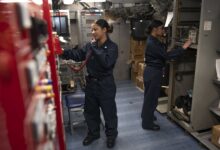 190914-N-PX867-1031 GULF OF ADEN (Sept. 14, 2019) Information Systems Technician 2nd Class Erika Clark, left, and Information Systems Technician 3rd Class Ainesey Iguanzo, both assigned to amphibious assault ship USS Boxer (LHD 4), conduct a communications check in the radio shop. Boxer is part of the Boxer Amphibious Ready Group and 11th Marine Expeditionary Unit and is deployed to the U.S. 5th Fleet area of operations in support of naval operations to ensure maritime stability and security in the Central Region, connecting the Mediterranean and the Pacific through the Western Indian Ocean and three strategic choke points. (U.S. Navy photo by Mass Communication Specialist 3rd Class Justin Whitley/Released)