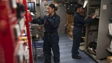 190914-N-PX867-1031 GULF OF ADEN (Sept. 14, 2019) Information Systems Technician 2nd Class Erika Clark, left, and Information Systems Technician 3rd Class Ainesey Iguanzo, both assigned to amphibious assault ship USS Boxer (LHD 4), conduct a communications check in the radio shop. Boxer is part of the Boxer Amphibious Ready Group and 11th Marine Expeditionary Unit and is deployed to the U.S. 5th Fleet area of operations in support of naval operations to ensure maritime stability and security in the Central Region, connecting the Mediterranean and the Pacific through the Western Indian Ocean and three strategic choke points. (U.S. Navy photo by Mass Communication Specialist 3rd Class Justin Whitley/Released)
