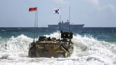 220730-N-LI768-1225 MARINE CORPS BASE HAWAII, Hawaii (July 30, 2022) A Korean amphibious assault vehicle from the Republic of Korea Marines departs Pyramid Rock Beach to return to amphibious assault ship ROKS Marado (LPH 6112) following an amphibious raid during a multinational littoral operations exercise as part of Rim of the Pacific (RIMPAC) 2022. Twenty-six nations, 38 ships, three submarines, more than 170 aircraft and 25,000 personnel are participating in RIMPAC from June 29 to Aug. 4 in and around the Hawaiian Islands and Southern California. The world’s largest international maritime exercise, RIMPAC provides a unique training opportunity while fostering and sustaining cooperative relationships among participants critical to ensuring the safety of sea lanes and security on the world’s oceans. RIMPAC 2022 is the 28th exercise in the series that began in 1971. (U.S. Navy photo by Mass Communication Specialist 1st Class Devin M. Langer)