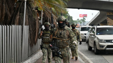 Ecuadorian soldiers at the state-owned TV station that gang members stormed