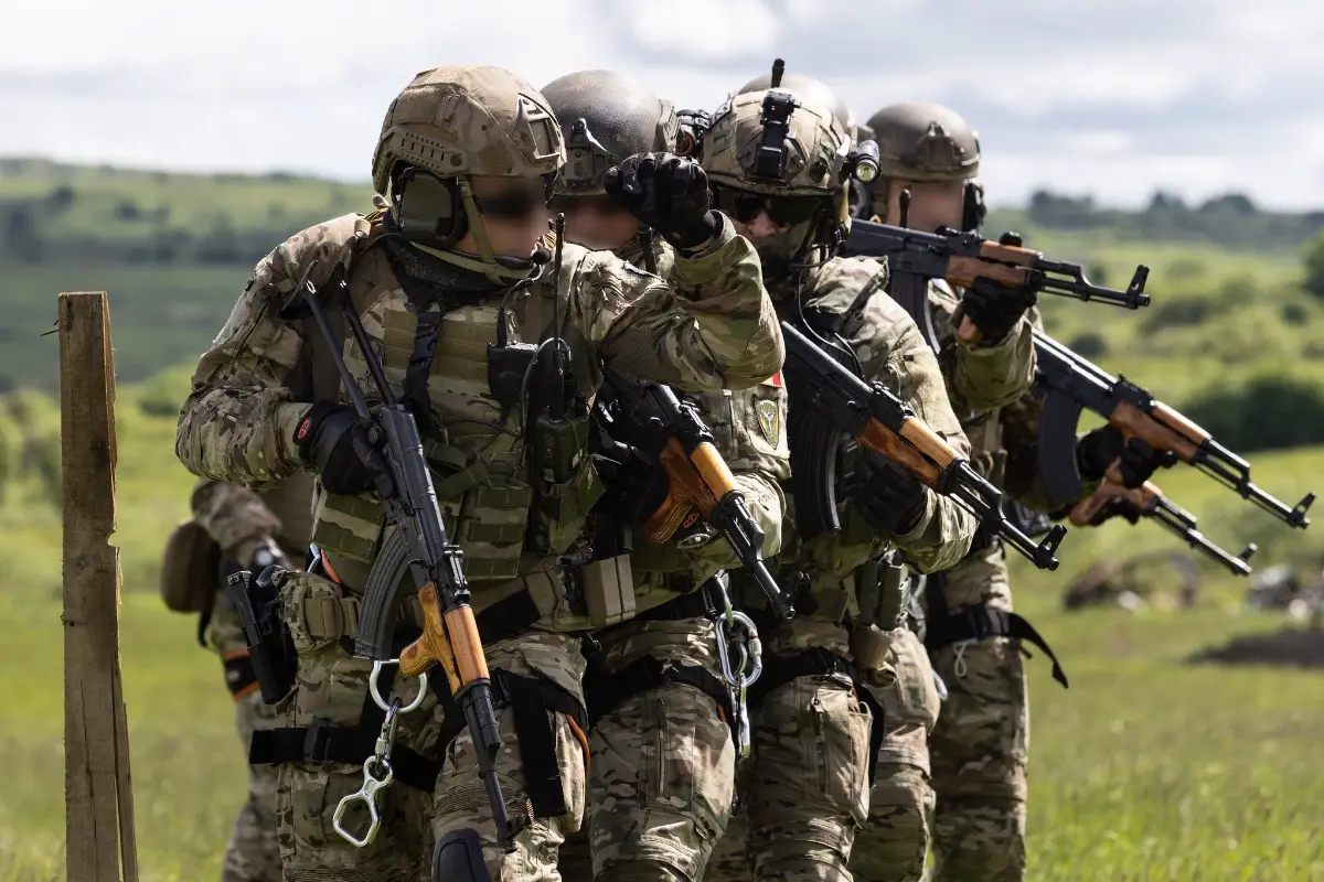 Romanian Special Forces operators prepare to execute a simulated breach during exercise Steadfast Defender 2021.