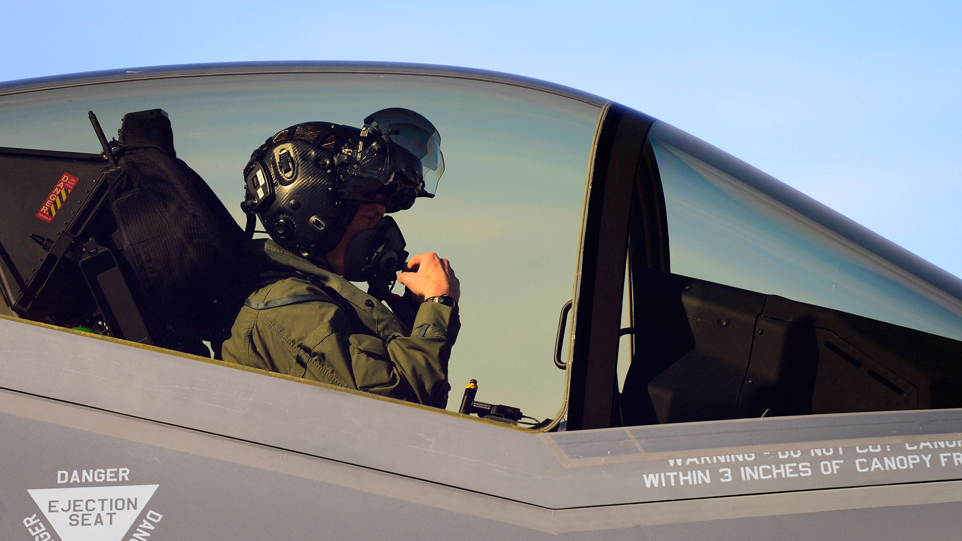 Pilot wearing Gen III Helmet Mounted Display System in an F-35 cockpit