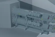 An artist's 3d rendering of a SEA Torpedo Launch System. The gray equipment appears to be two metallic containers shaped like long canisters. They appear to be covered in rivets and small mechanisms.