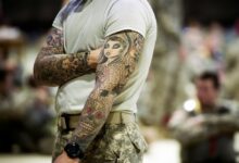 soldier with full-sleeve tattoos