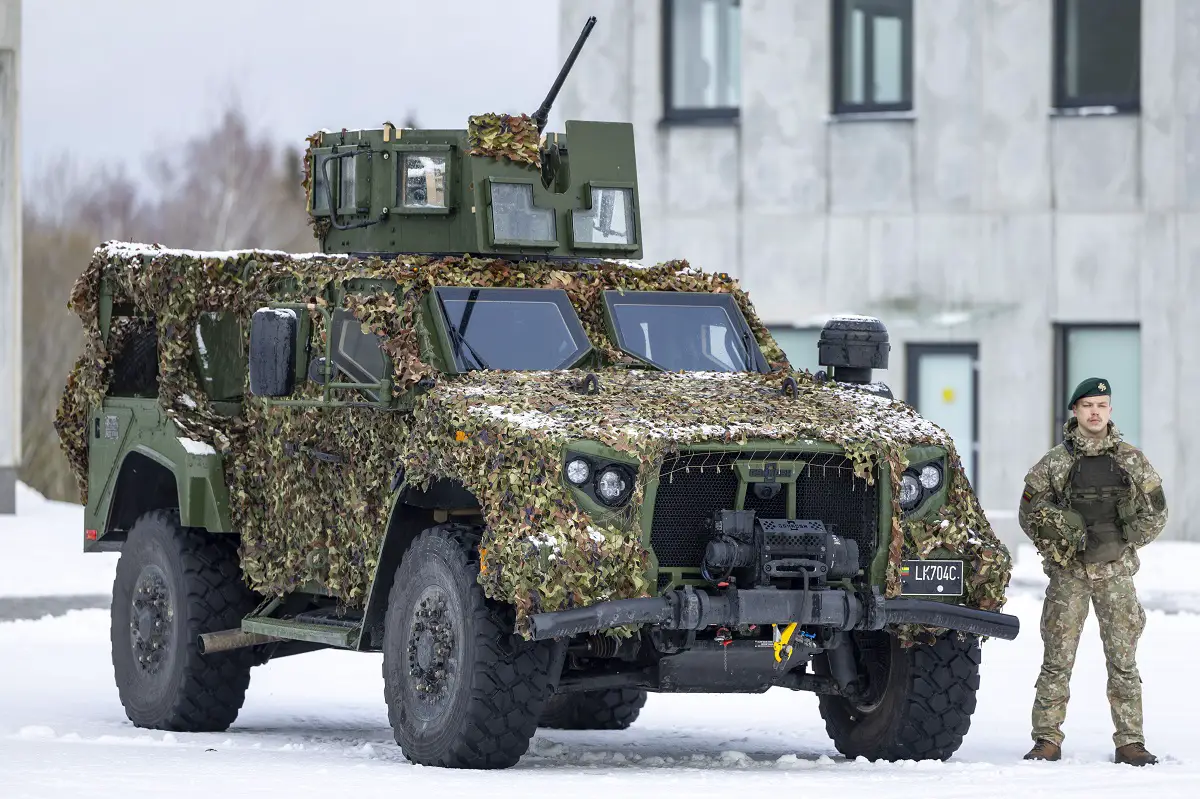Soldier and a military vehicle in front of a newly-built military campus in Rokantiškės
