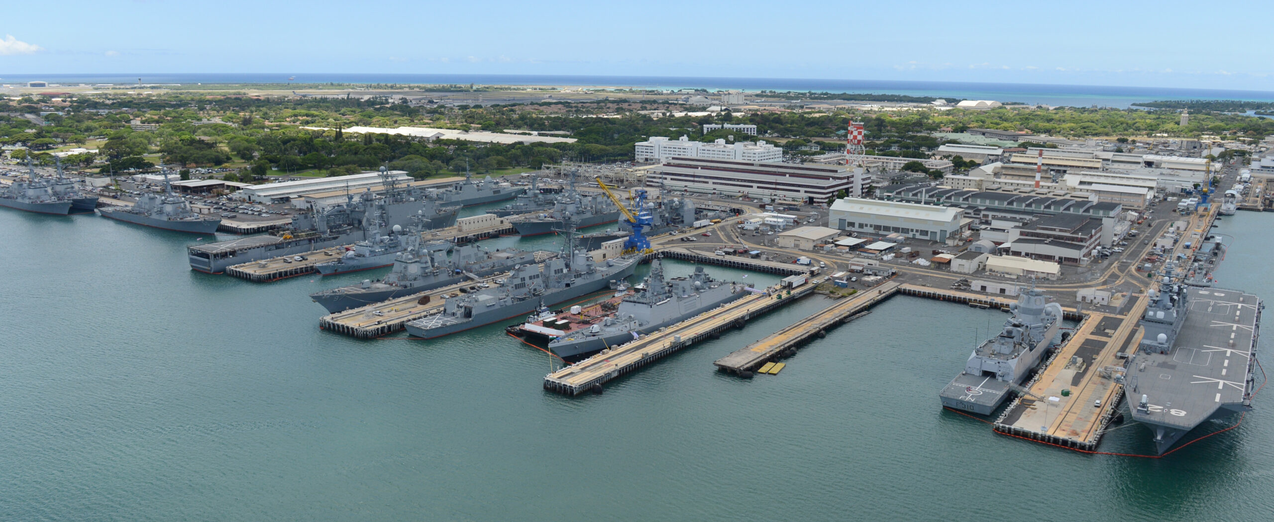 An aerial view of ships moored at Joint Base Pearl Harbor-Hickam during Rim of the Pacific (RIMPAC) Exercise 2014. The world's largest international maritime exercise, RIMPAC provides a unique training opportunity that helps participants foster and sustain the cooperative relationships that are critical to ensuring the safety of sea lanes and security on the world's oceans. Twenty-two nations, more than 49 ships, six submarines, more than 200 aircraft and 25,000 personnel are participating in RIMPAC. (U.S. Navy photo by Mass Communication Specialist 1st Class Shannon E. Renfroe/Released)