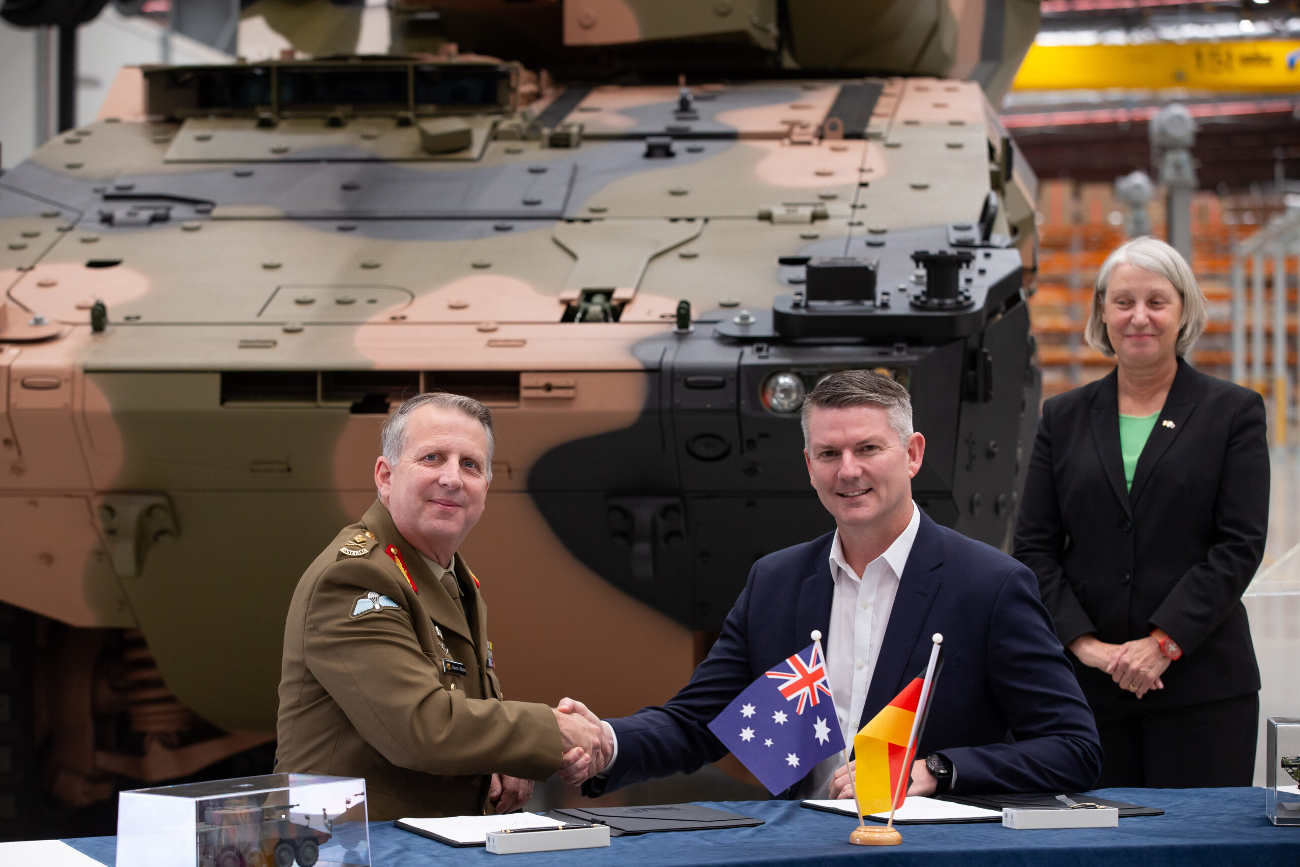 Head Land Systems, Major General Blain and Managing Director Rheinmetall Defence Australia, Nathan Poyner, signed the Production Contract for the Boxer Heavy Weapon Carrier Vehicle Export, observed by German Ambassador to Australia, Beate Grzeski, in Brisbane on 10 April 2024. *** Local Caption *** Head Land Systems, Major General Blain and Managing Director Rheinmetall Defence Australia, Nathan Poyner, signed the Production Contract for the Boxer Heavy Weapon Carrier Vehicle Export. The event was observed by the German Ambassador to Australia, Beate Grzeski, and occurred at the Rheinmetall Military Vehicle Centre of Excellence in Redbank, Queensland on 10 April 2024. The signing the production contract fulfils the intent of the bilateral agreement signed by the Australian and German Governments in March, to export more than 100 Australian-made Boxer Heavy Weapon Carrier vehicles to Germany.