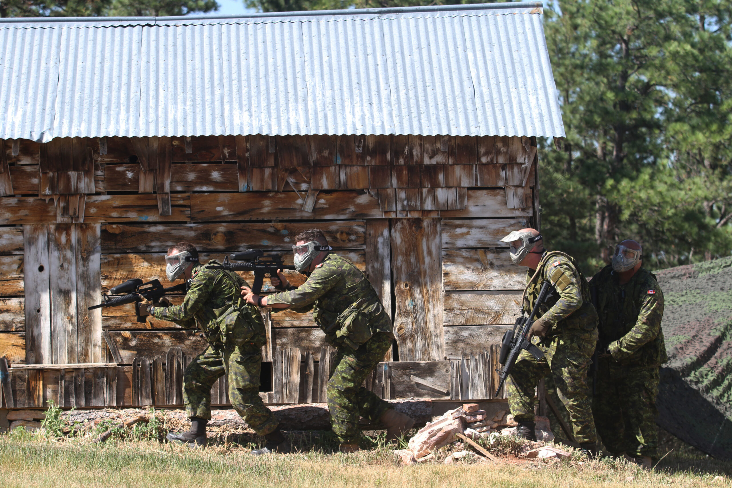 Soldiers of Task Force 41, Canadian Army, prepare to enter a building at the urban patrol training lane on West Camp Rapid, Rapid City, S.D., on June 16, 2016. This event was a part of the 32nd South Dakota National Guard Golden Coyote training exercise.