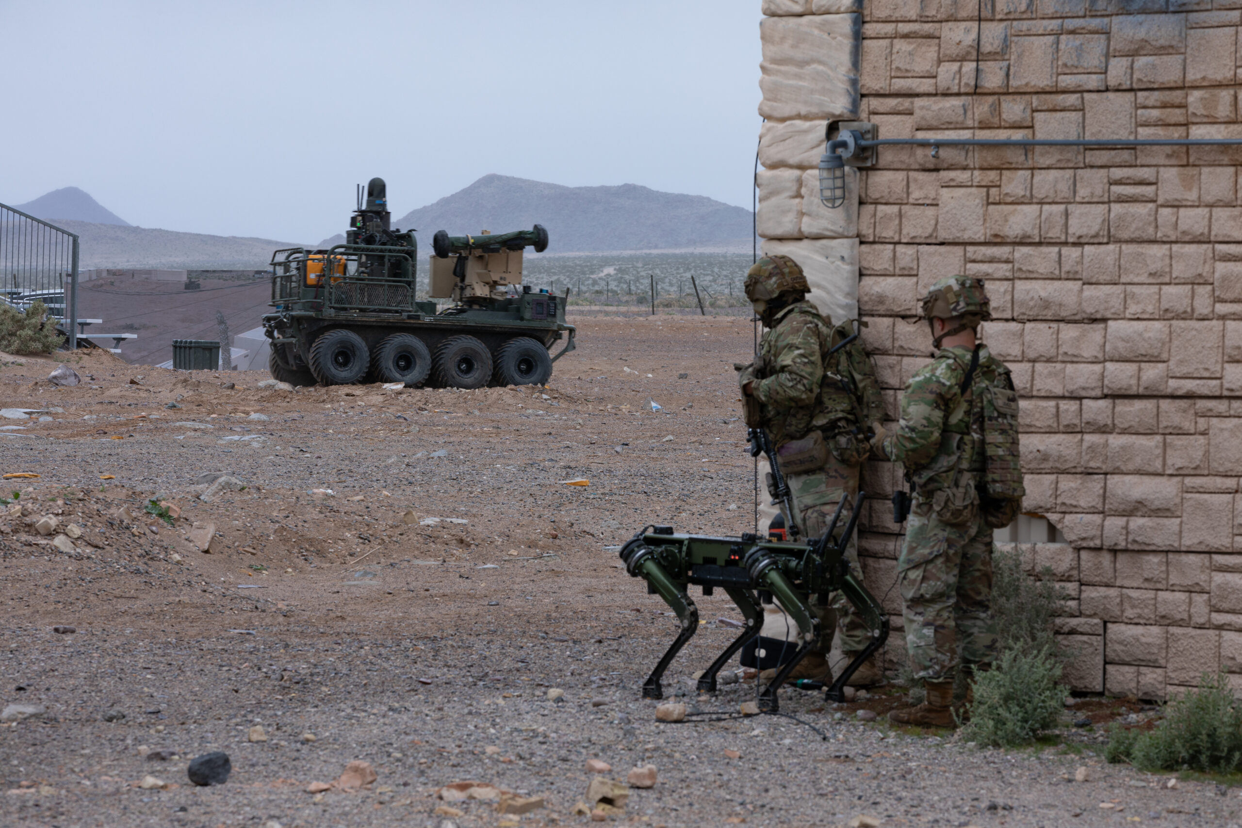 U.S. Soldiers assigned to the 1st Battalion, 29th Infantry Regiment, based out of Fort Moore, Ga., take part in a human machine integration demonstration using the Ghost Robotic Dog, and the U.S. Army Small Multipurpose Equipment Transport (SMET) of new U.S. Army capabilities at Project Convergence - Capstone 4 in Fort Irwin, Calif., March 15, 2024. The robotic dog is a mid-sized, high-endurance, agile unmanned ground vehicle that provides enhanced reconnaissance and situational awareness supporting Soldiers on the ground. The SMET is an eight-wheeled, enabling robotic technology serving as a “robotic mule” with a wide range of flexibility to operate in combat, combat support and combat service support operations. (U.S. Army photo by Spc. Samarion Hicks)