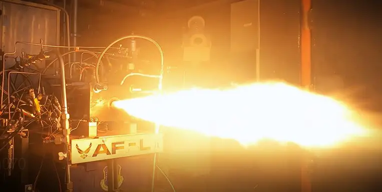 The Air Force Research Laboratory, or AFRL, Rocket Propulsion Division, recently designed, printed, built and hot fired a first-ever, single-block rocket-engine thrust chamber additively manufactured using a process called laser powder directed energy deposition, or DED. DED is an additive manufacturing process in which the device injects metal powder into focused beams of high-power laser in highly controlled atmospheric conditions. The Hotfire of the thrust chamber is shown in the Experimental Cell 1 (EC-1) at the AFRL Rocket Lab. (U.S. Air Force photo)