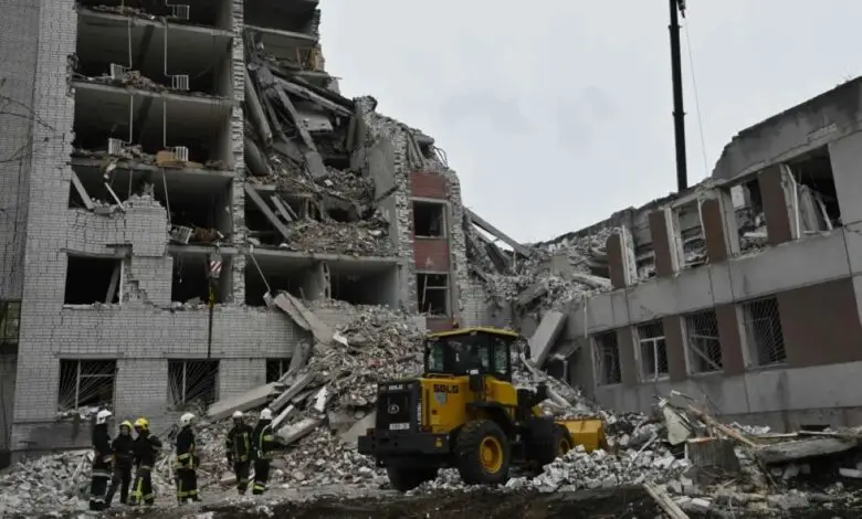 Ukrainian rescuers clear the rubble of a destroyed building following a missile attack on Ukraine s Chernigiv on April 17, 2024