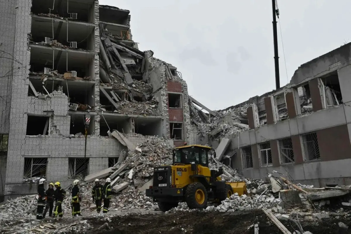 Ukrainian rescuers clear the rubble of a destroyed building following a missile attack on Ukraine s Chernigiv on April 17, 2024
