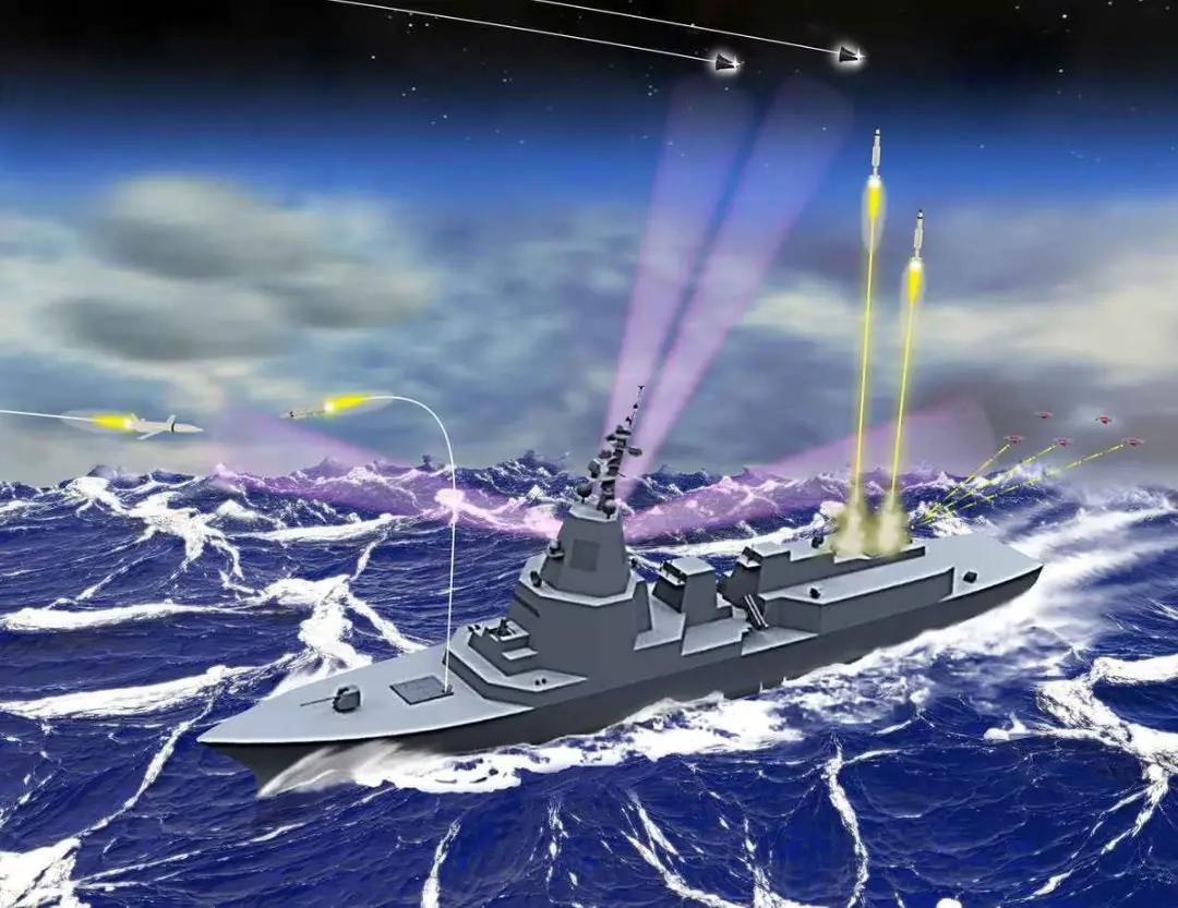 An artist's impression of the AN/SPY-7(V)1 radar-fitted Aegis System Equipped Vessel (ASEV). The gray ship is seen sailing in rough waters. Three missiles are seen firing off from it, with one maneuvering to hit an airborne missile fired by an unknown source. By the back of the ship, three laser-like lights target a group of five drones flying above. Two triangle-shaped objects are seen hovering above the entire scene.