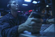 220828-N-UA460-1019 PHILIPPINE SEA (Aug. 28, 2022) – Fire Controlman 2nd Class Dylan Shubin, from Norco, California, mans a console in the combat information center aboard Arleigh Burke-class guided-missile destroyer USS Barry (DDG 52) during live-fire missile exercise as part of Pacific Vanguard (PV) 2022 while operating in the Philippine Sea, Aug. 28. PV22 is an exercise with a focus on interoperability and the advanced training and integration of allied maritime forces. (U.S. Navy photo by Mass Communication Specialist 1st Class Greg Johnson)