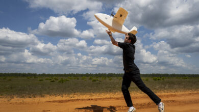 Noah Benton, Titan Dynamics chief technology officer, launches a an eight-pound, 3-D-printed unmanned aerial system during a Blue Horizons demonstration April 25, 2024 at Eglin Air Force Base, Florida. The goal of the demonstration was to create, build and fly a UAS within 24 hours. The team spent the week at Eglin creating UASs for various designs and mission specialties. (U.S. Air Force photo by Samuel King Jr.)