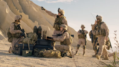 Soldiers are Using Laptop Computer afor Surveillance During Military Operation in the Desert.